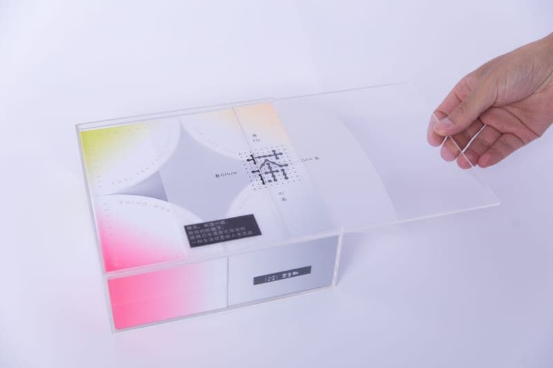 A fabric enclosure tent surrounding a desktop 3D printer