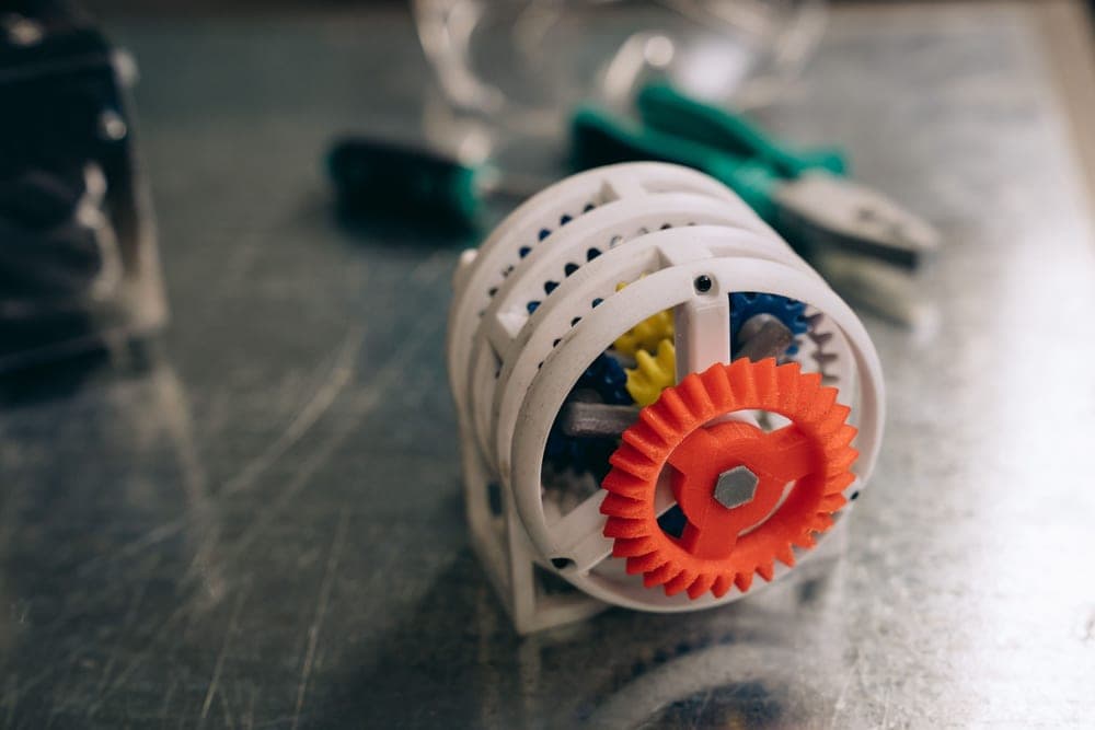 3D printed parts and hand tools on a workbench
